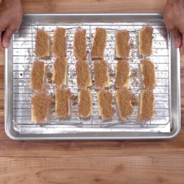 Bacon Crackers on wire rack on top of baking sheet.