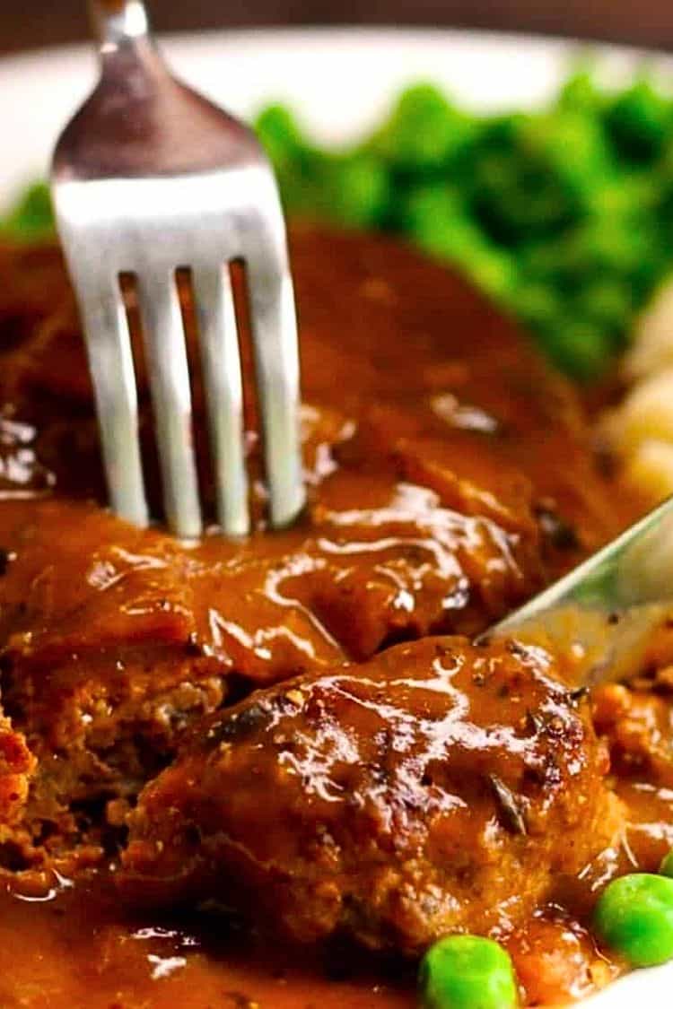 Salisbury Steak plated cut with knife and fork