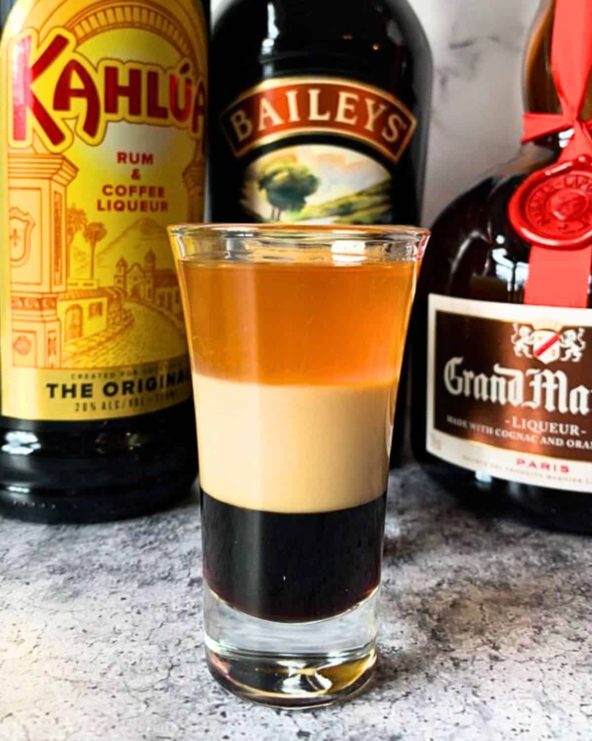 B-52 shot in front of Kahlua, Baileys, and Grand Marnier.