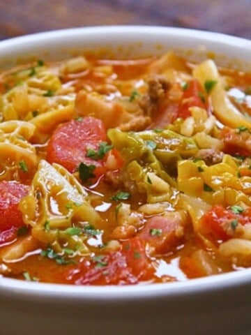 Close-up of cabbage roll soup in bowl.