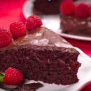 Crazy chocolate cake plated with raspberries.