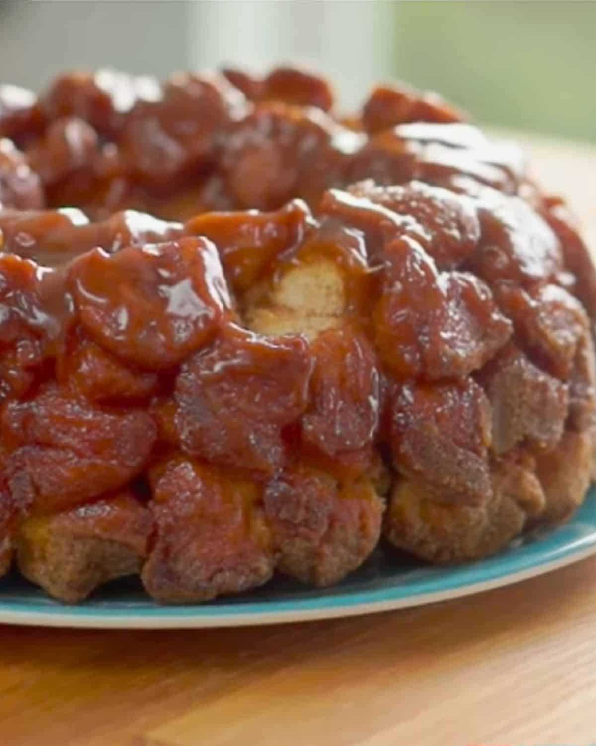 Monkey bread on blue plate with missing piece.
