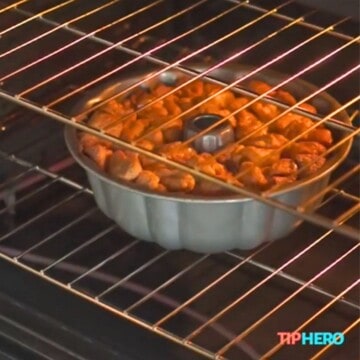 Monkey bread in bundt pan in oven.