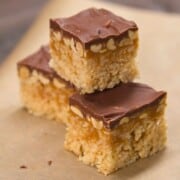 Close up of Snickers-Inspired Rice krispies treat on was paper.