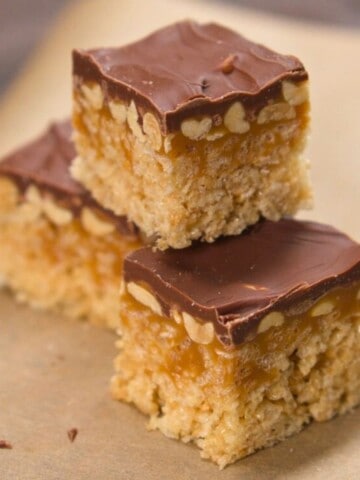 Close up of Snickers-Inspired Rice krispies treat on was paper.